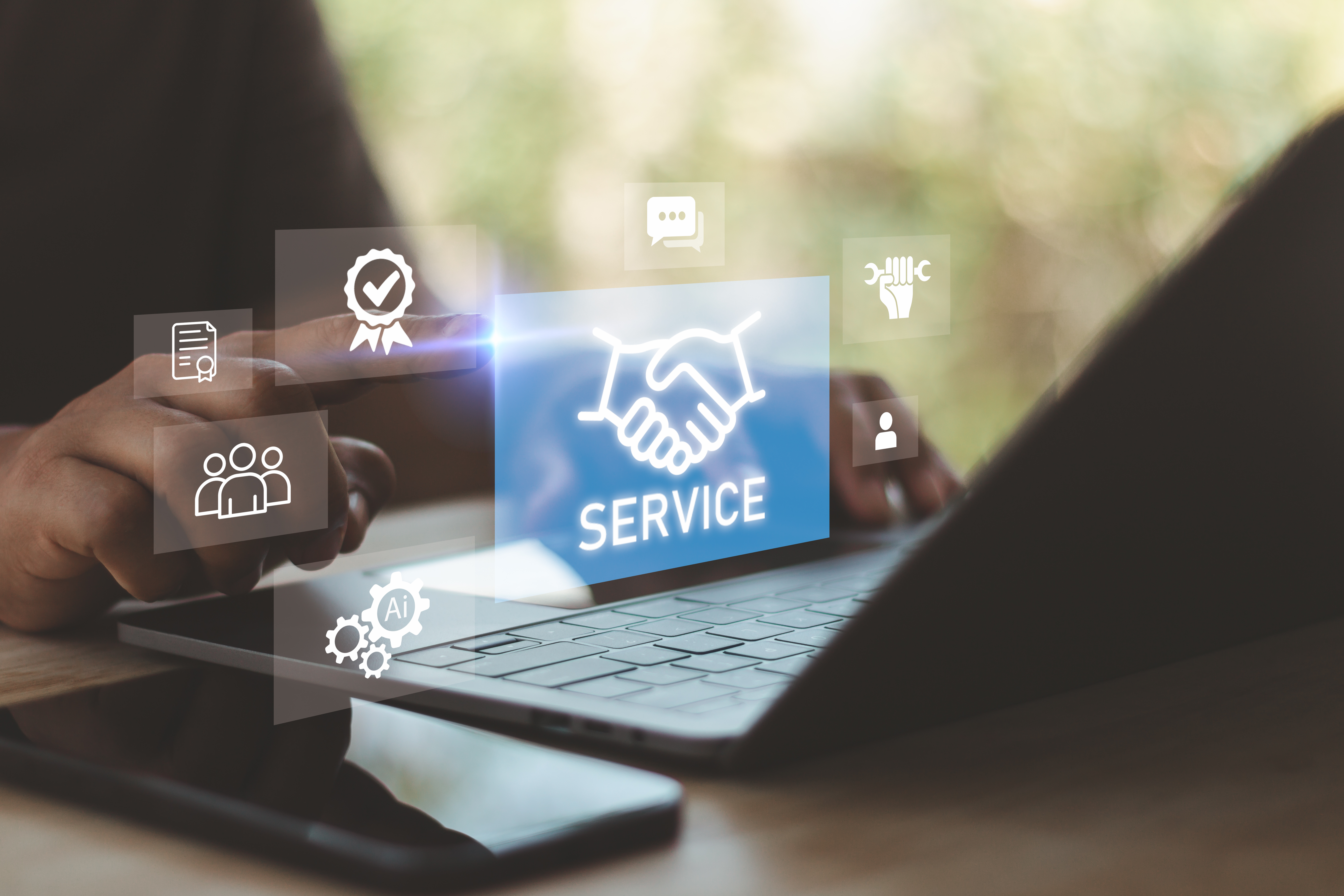 Business service and customer support concept with businessman using laptop and virtual handshake interface. Digital assistance, AI automation, help desk solution and corporate partnership technology.