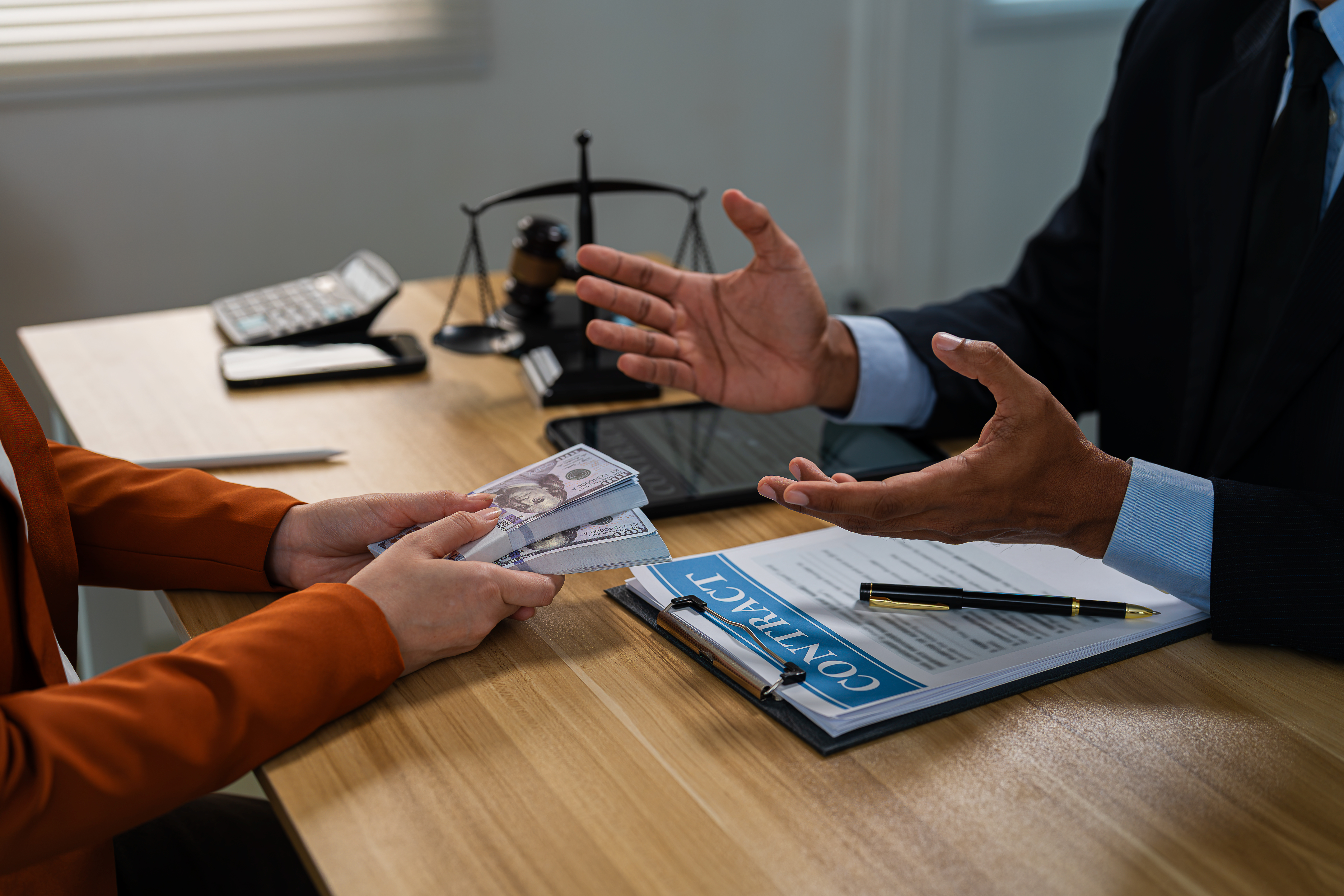 Businessman secretly giving money bribe to law officer or partner under a contract agreement.